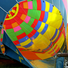 passengers around a hot air balloon