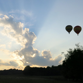 hot air balloon rays of sunshine